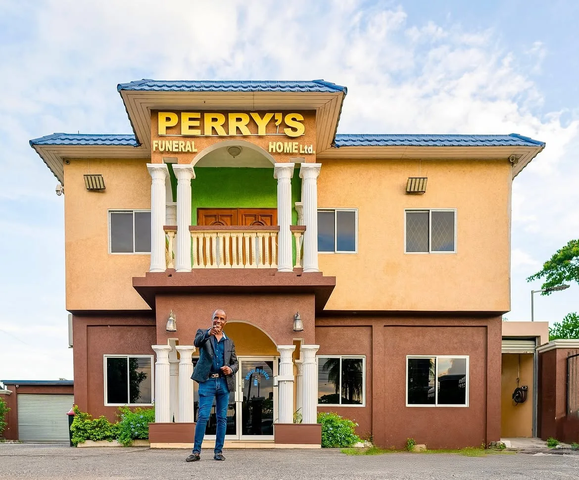 Peter Perry standing outside Perry's Funeral Home at 27 Job Lane