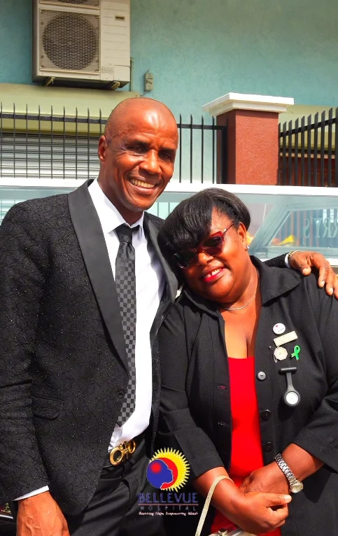 Two members of the Perry's Funeral Home team standing together outdoors